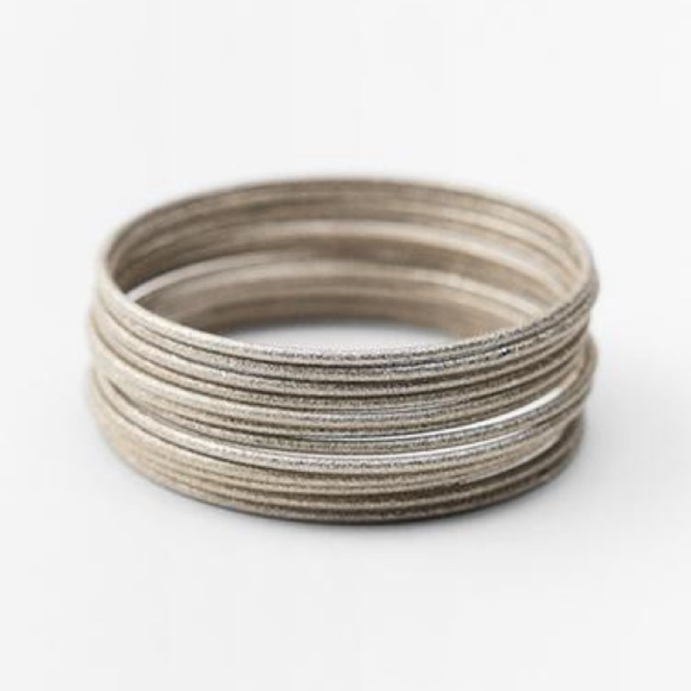 NWT. Zara Silver Set of Metal Bracelets with Relief Pattern.